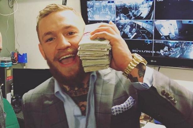 Conor McGregor holding cash