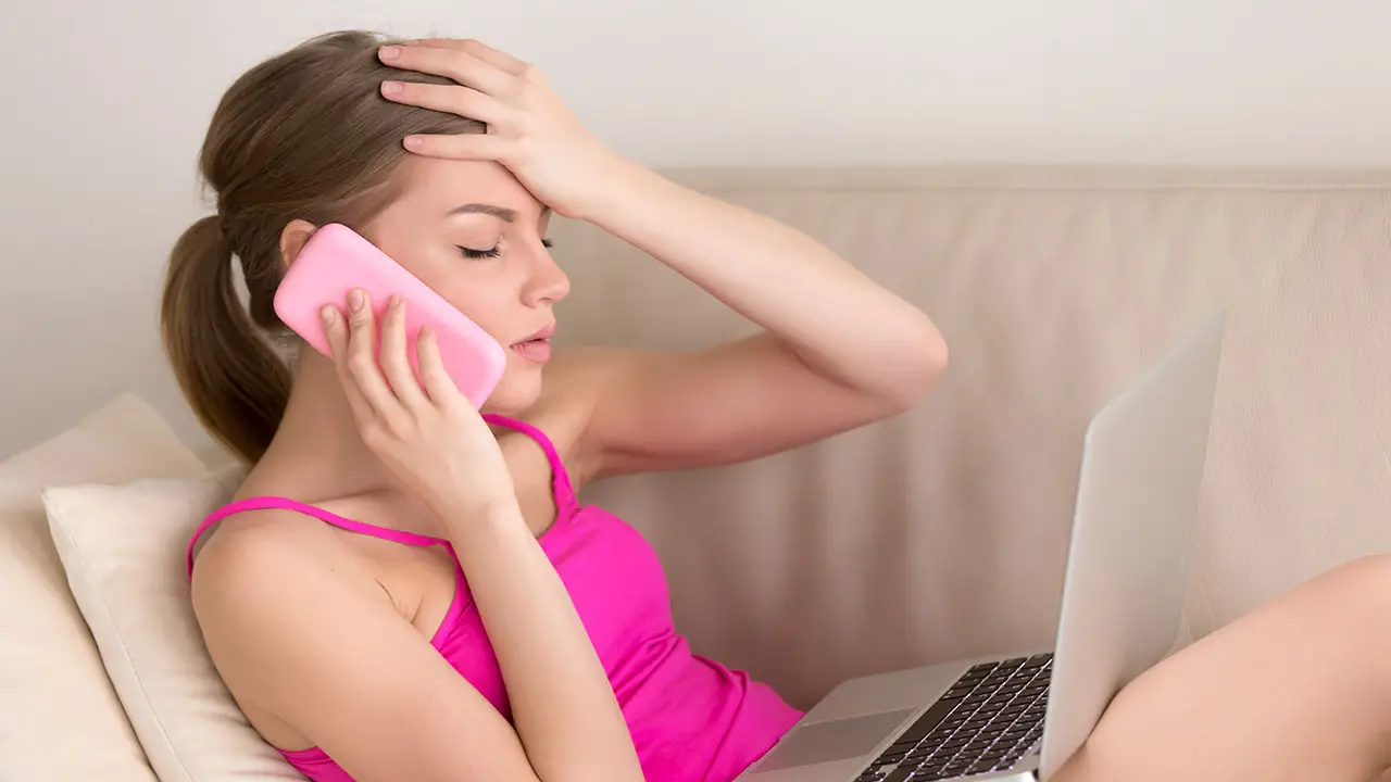 Frustrated woman over the phone