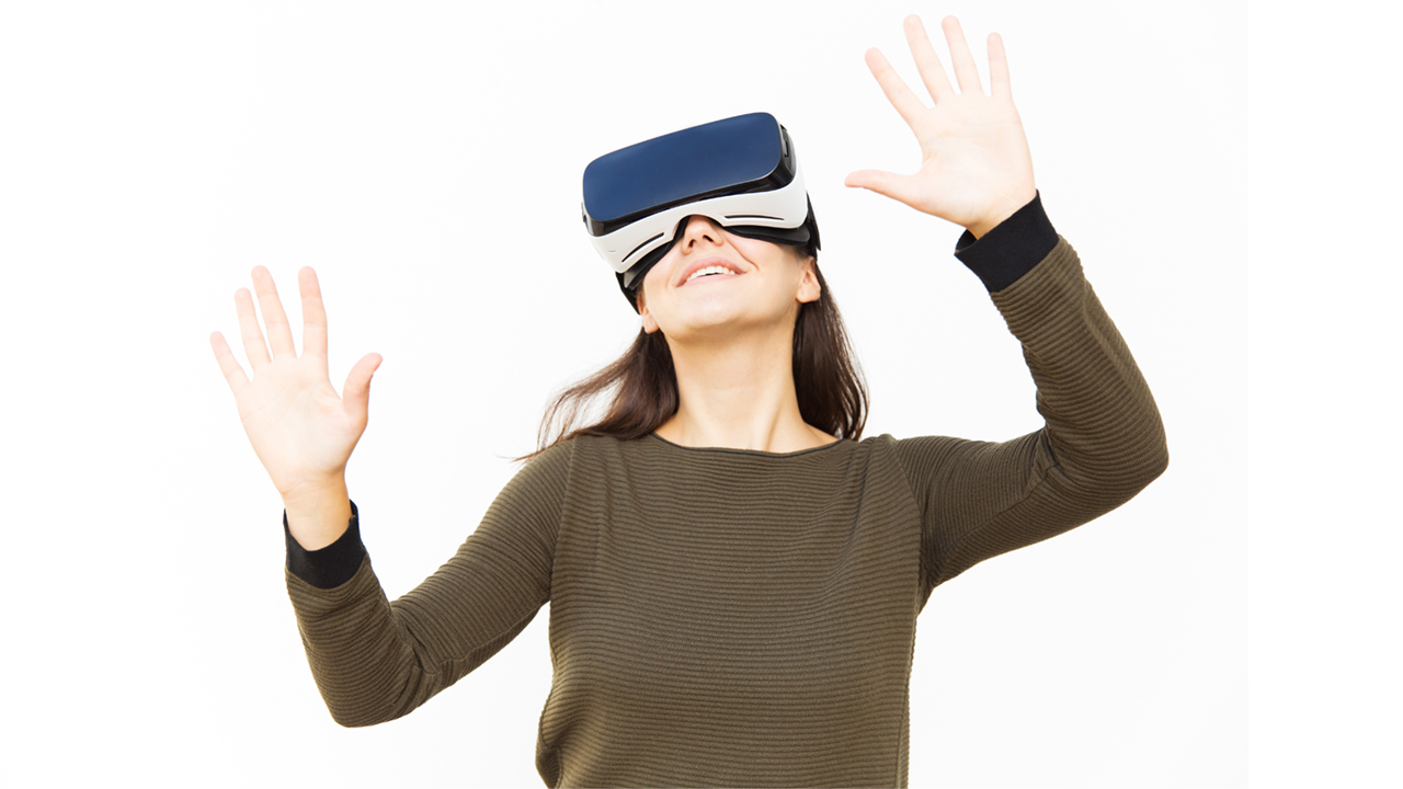 Joyful happy woman in VR headset