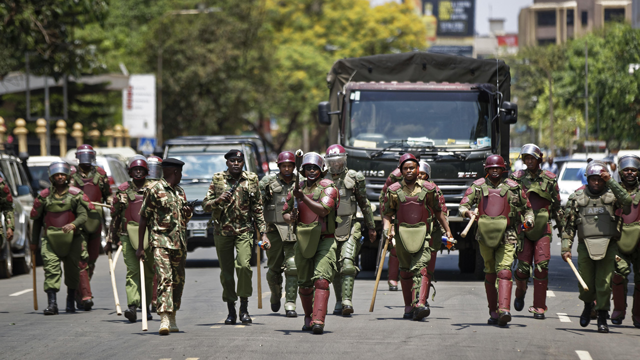 Kenya police men walking the streets