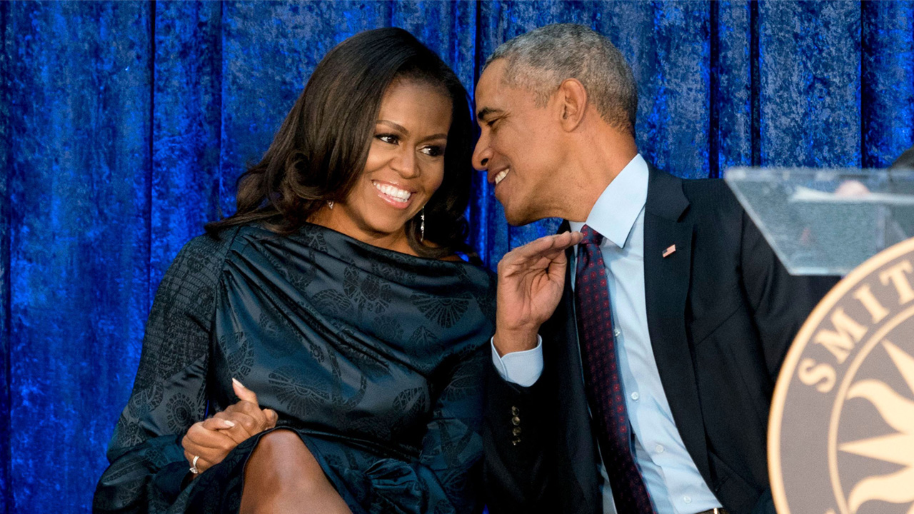 Michelle Obama and Barack Obama having a good conversation