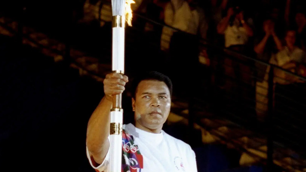 Muhammad Ali Lights Olympic Torch in 1996 Olympics