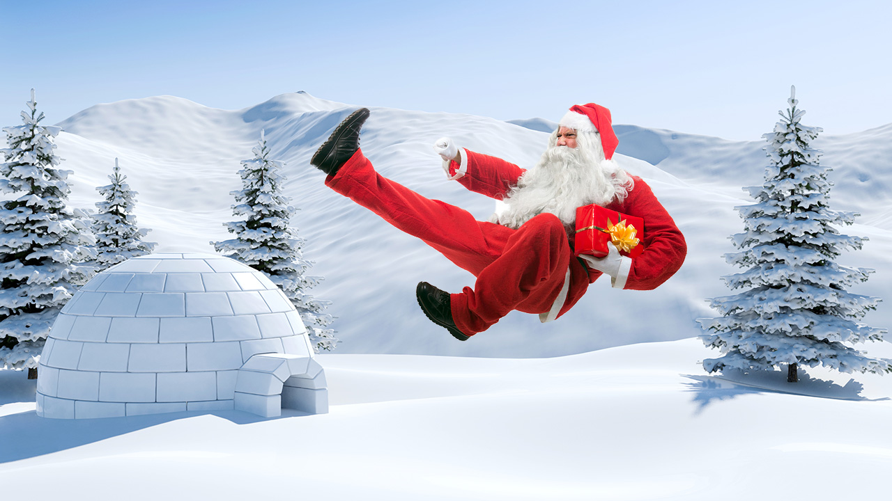 Santa doing a flying kick at the North Pole