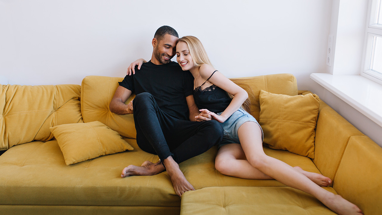 Couple embracing each other on a couch