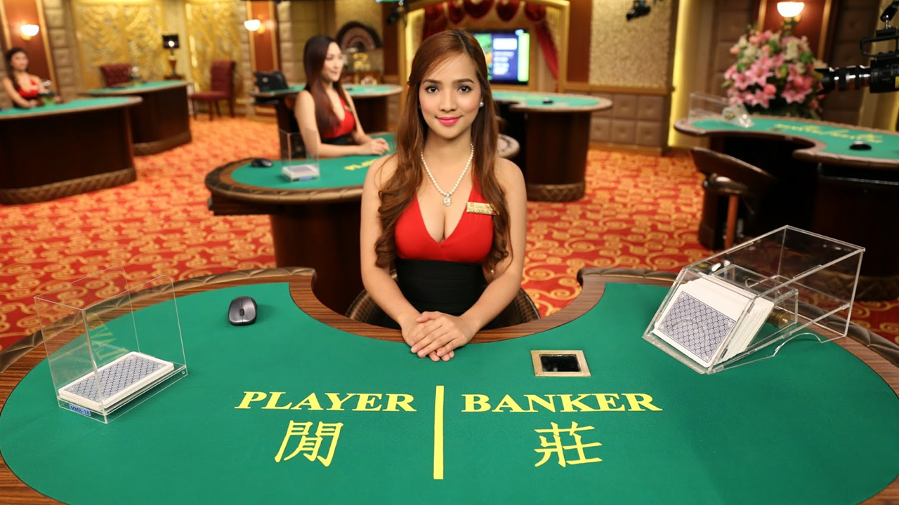A Baccarat table with a female dealer dress in red and black