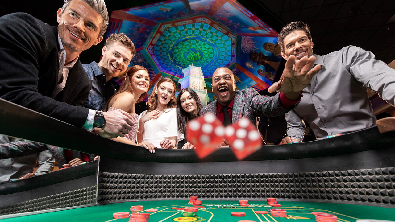 Happy group of players playing a game of Craps