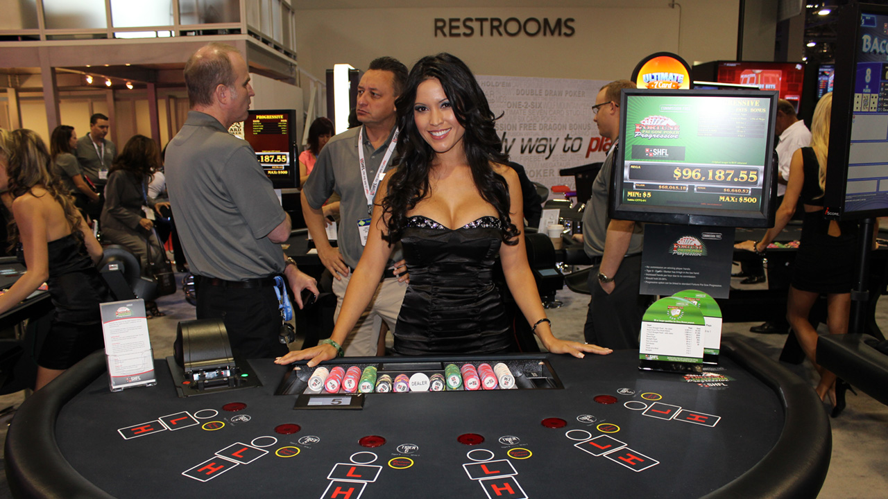 A female dealer waiting to play Pai Gow Poker with the next player