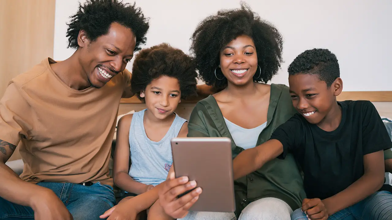 A happy family looking at DNA testing results