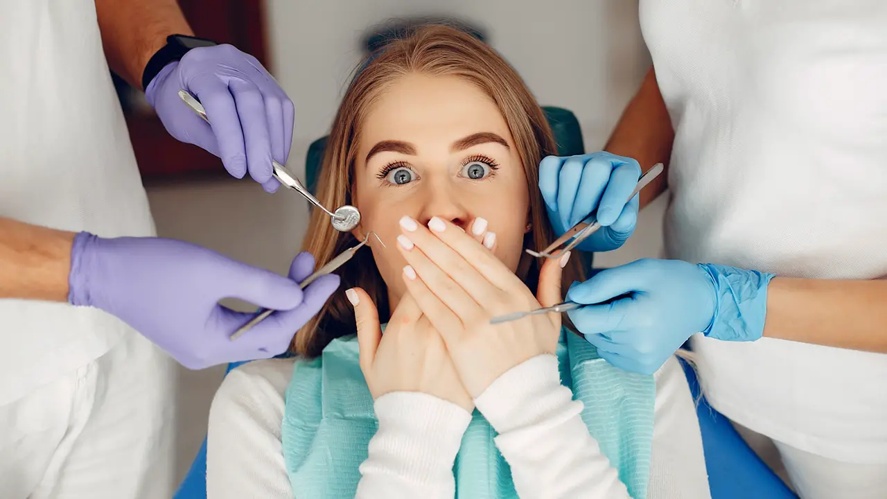 Beautiful girl sitting in the dentist