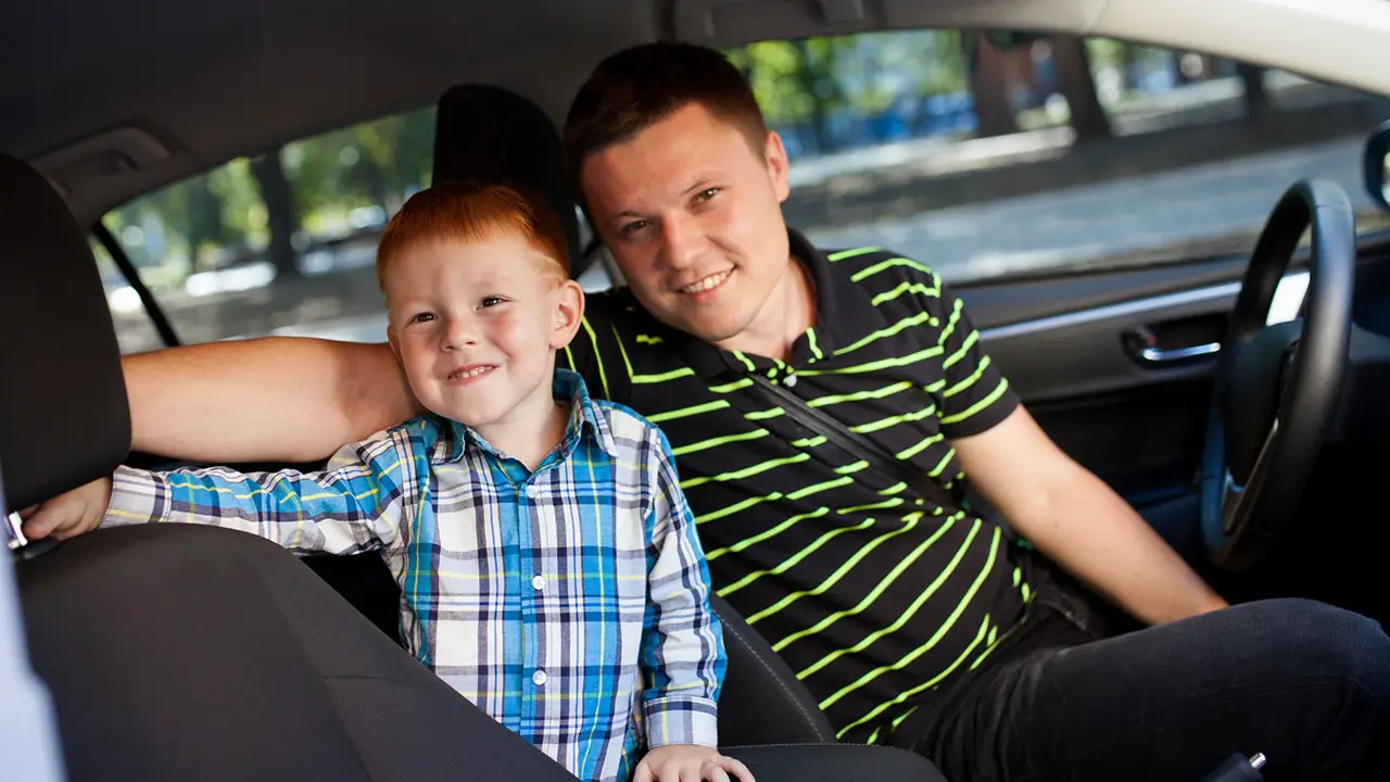 Dad and son in car