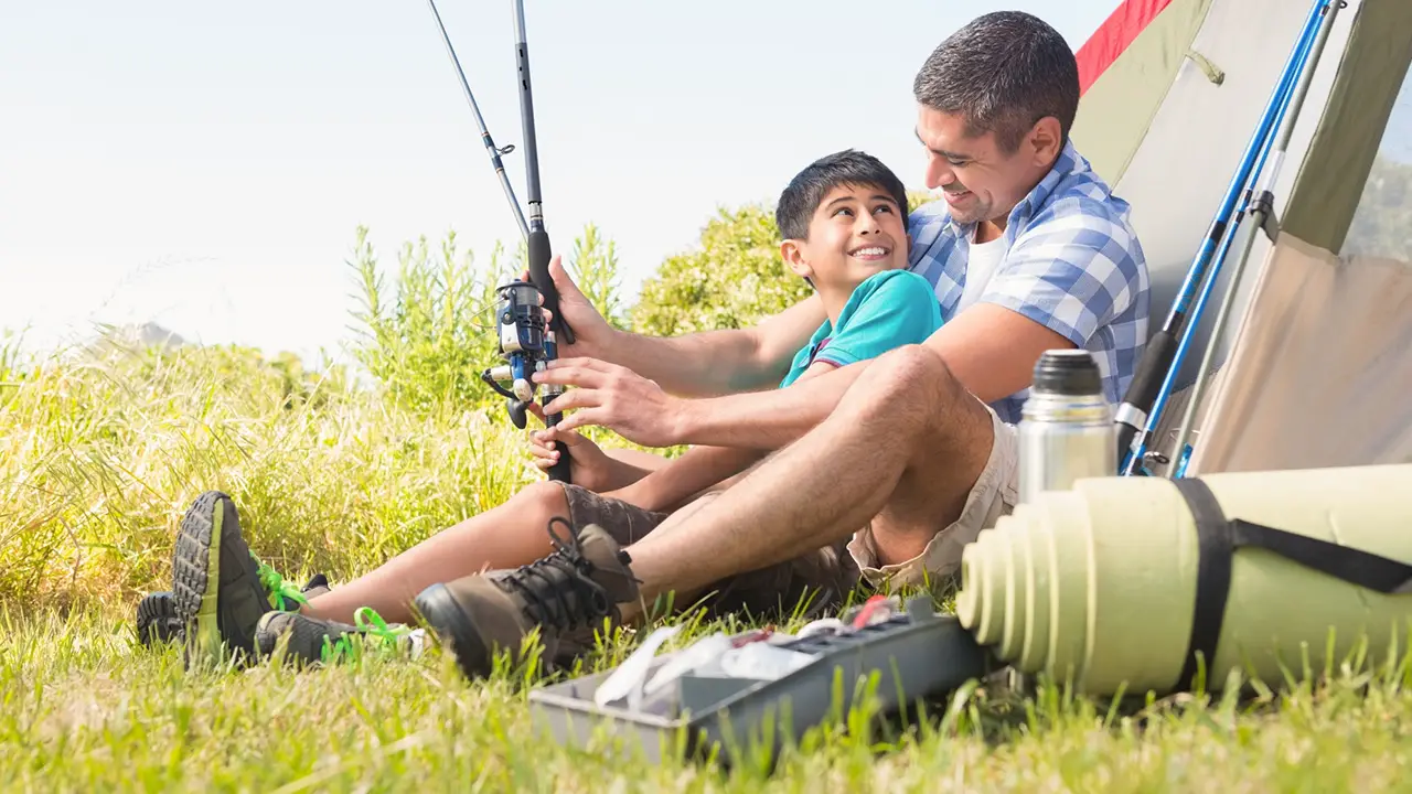 Father and son camping together