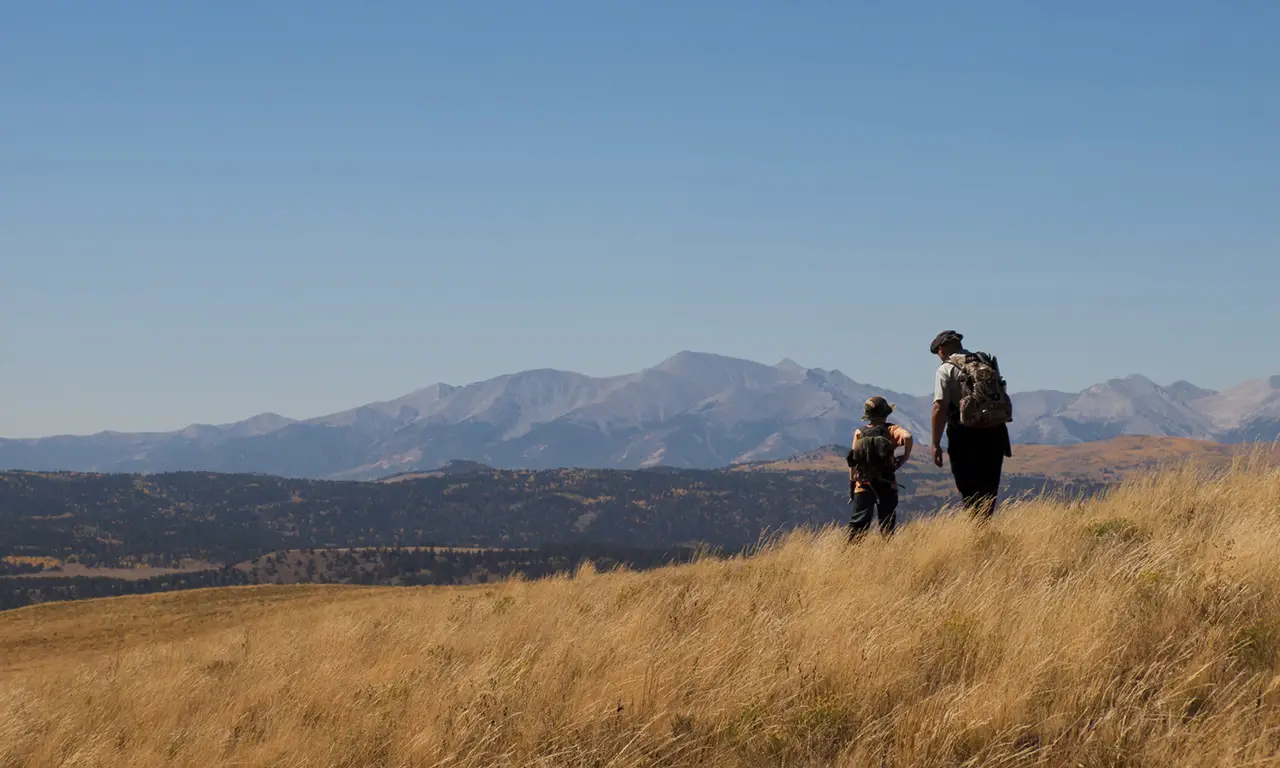 Father and son hunting outside