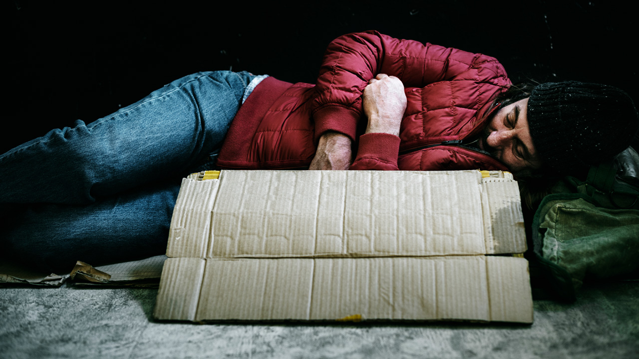A homeless man sleeping street