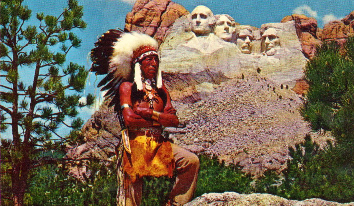 Indian posing near Mount Rushmore