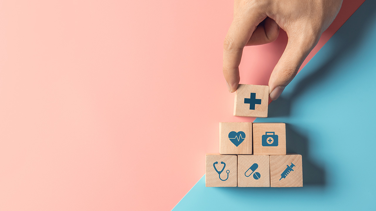 Arranging wood cube stacking with icon healthcare medical