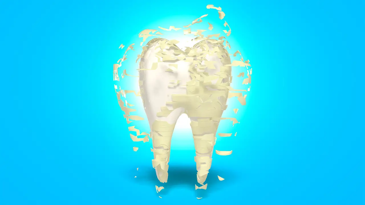 Tooth with yellow decay being stripped off