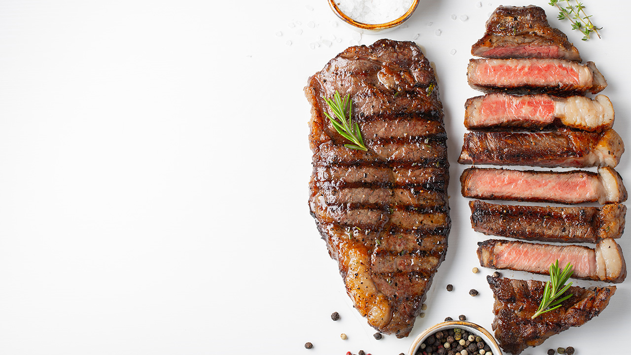 Two grilled marbled beef steaks striploin