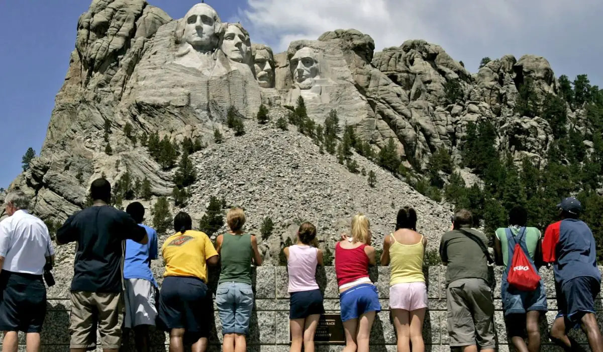 Group of tourists looking at Mount Rushmore