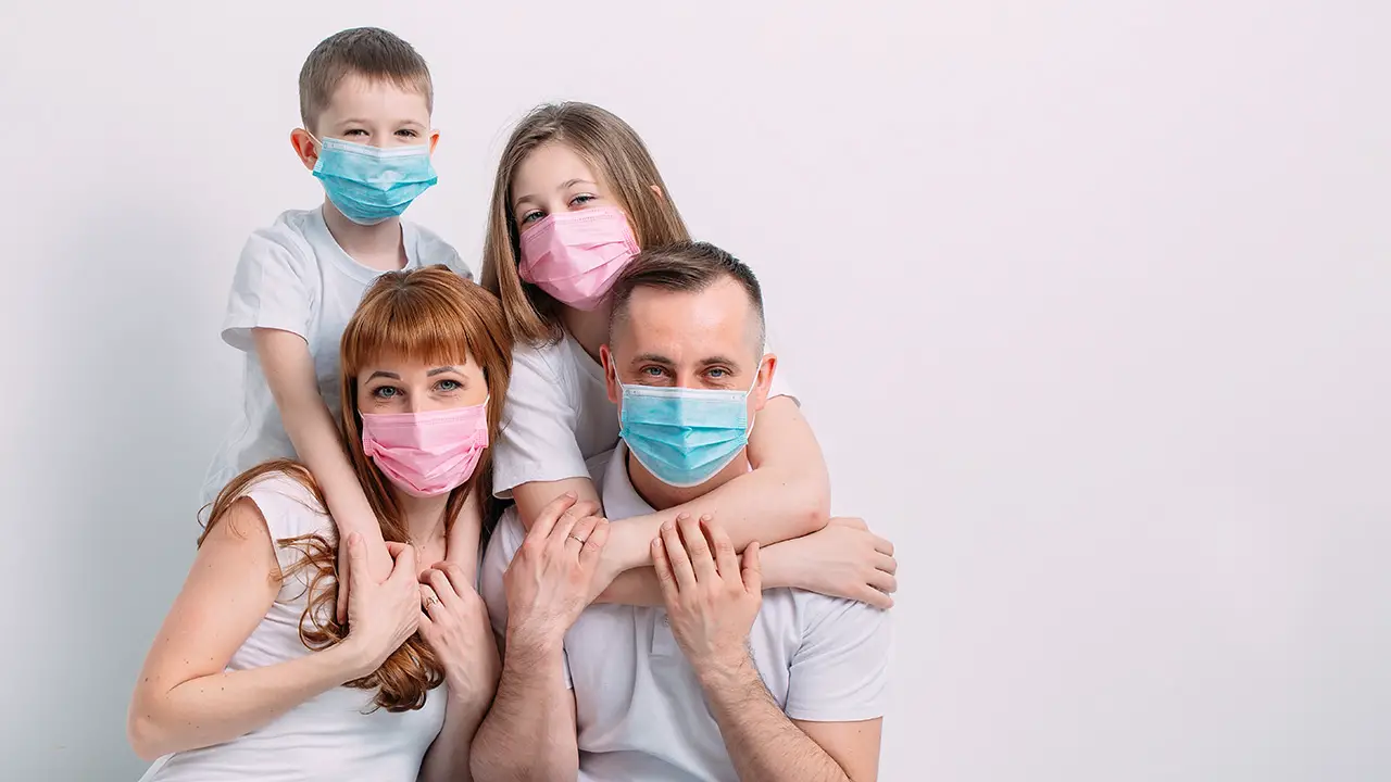 Young family medical masks during home quarantine